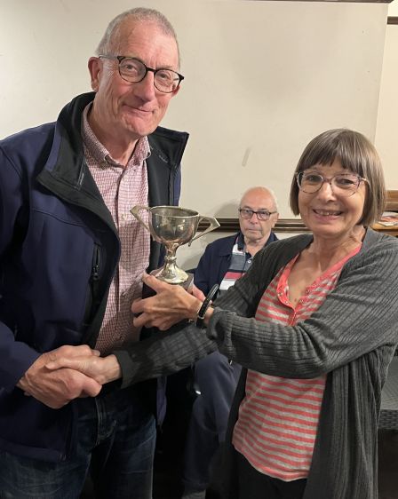 Julie presents Tony with the Presidents cup